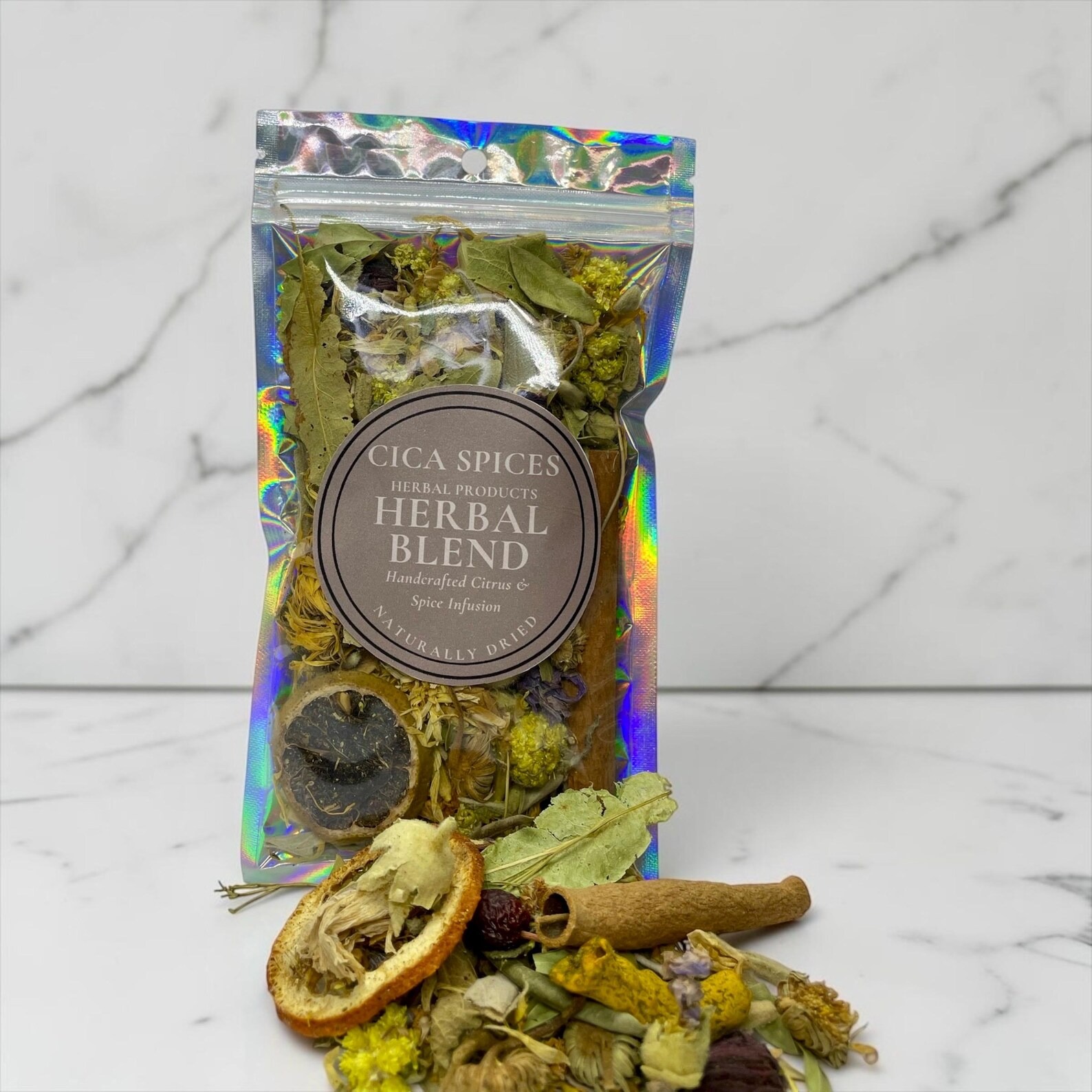 Pouch of herbal blend with dried citrus slices, cinnamon and herbs